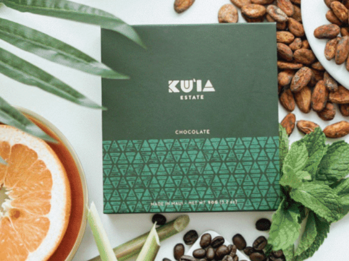 a table topped with a box of chocolate