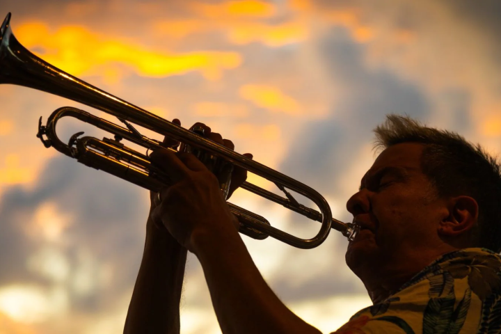 a close up of a man holding a gun