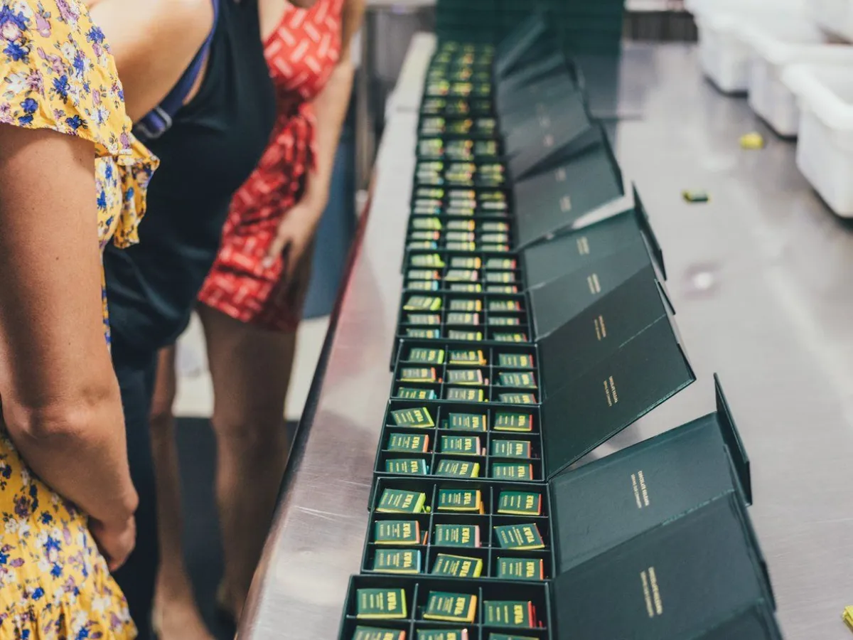a group of people looking at a computer