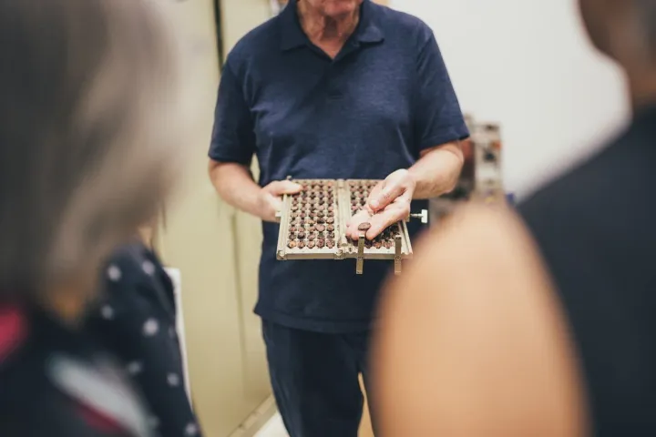 a person standing in front of a laptop