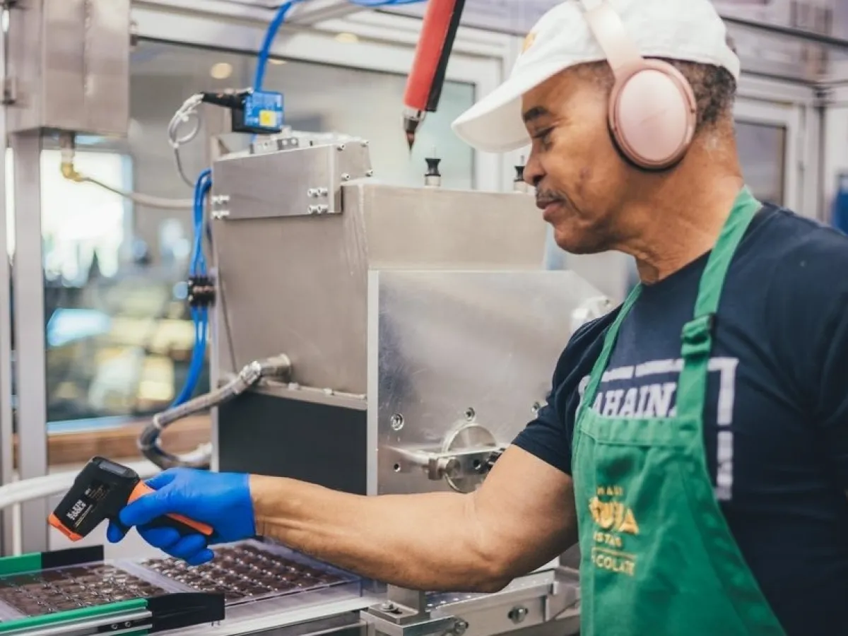 a man standing in front of a computer