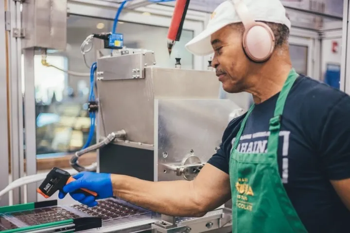 a man standing in front of a computer