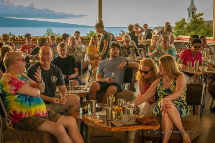 a group of people sitting at a table
