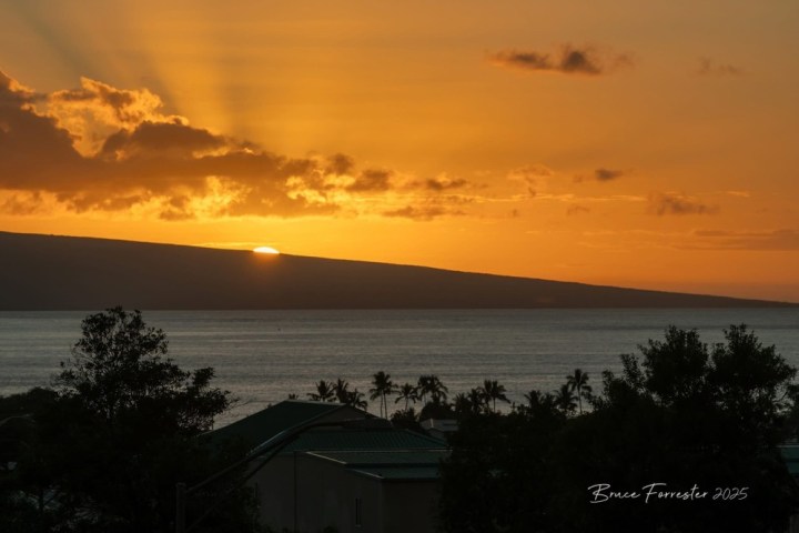 a sunset over a body of water